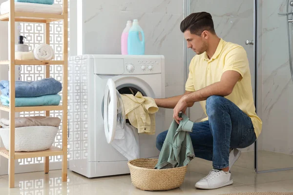 Man Putting Clothes Washing Machine Bathroom Laundry Day — Stock Photo, Image
