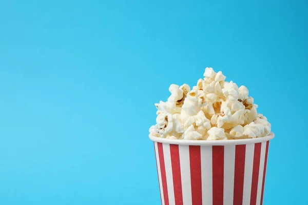 Delicious Popcorn Light Blue Background Closeup Space Text — Stock Photo, Image