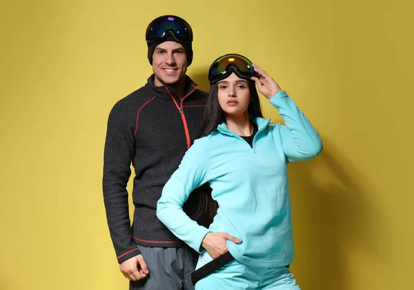 Couple Wearing Stylish Winter Sport Clothes Yellow Background — Stock Photo, Image