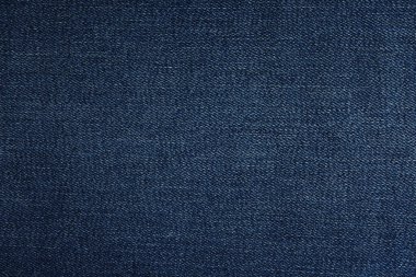 Arka plan olarak koyu mavi kotun dokusu, yakın plan