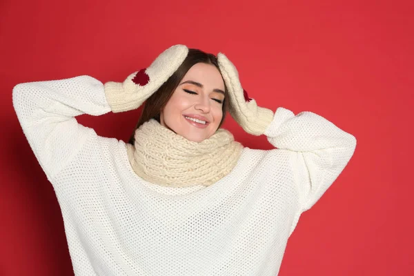 Young Woman Wearing Warm Sweater Mittens Red Background Winter Season — Stock Photo, Image