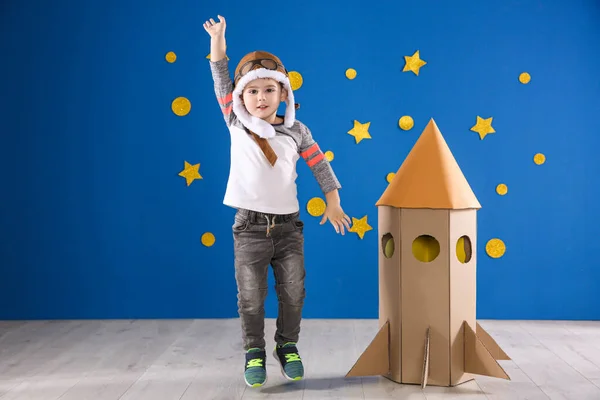 Cute Little Child Playing Cardboard Rocket Blue Wall — Stock Photo, Image