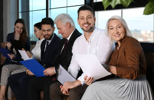 People waiting for job interview in office hall