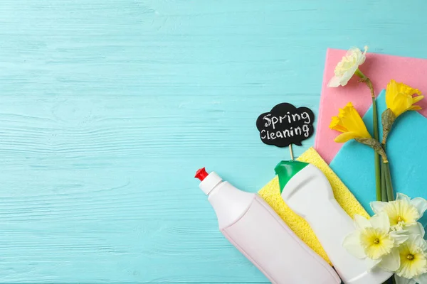 Composition Spring Cleaning Sign Flowers Detergents Light Blue Wooden Table — Stock Photo, Image