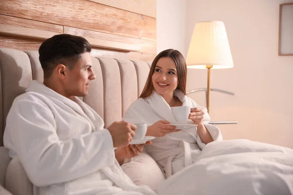 Happy Couple Bathrobes Coffee Bed Home — Stock Photo, Image