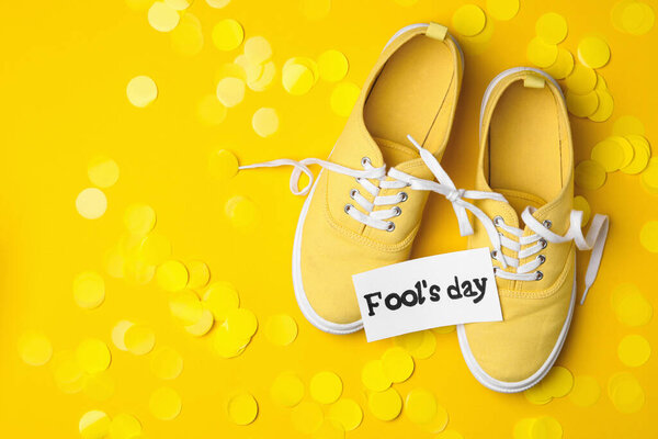 Shoes Tied Together Note Phrase Fool Day Confetti Yellow Background Royalty Free Stock Photos