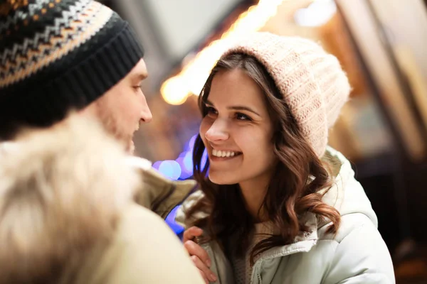 Lovely couple on city street. Winter vacation