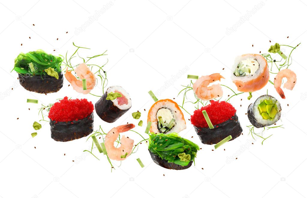 Delicious sushi rolls and ingredients on white background