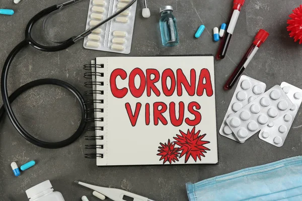 Блокнот Словами Corona Virus Стетоскоп Ліки Сірому Кам Яному Фоні — стокове фото