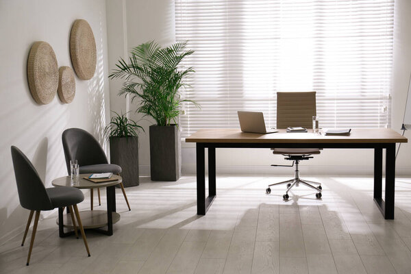 Director's office with large wooden table. Interior design