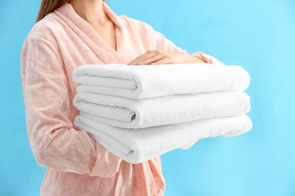 Woman Holding Stack Fresh Clean Towels Light Blue Background Closeup — Stock Photo, Image