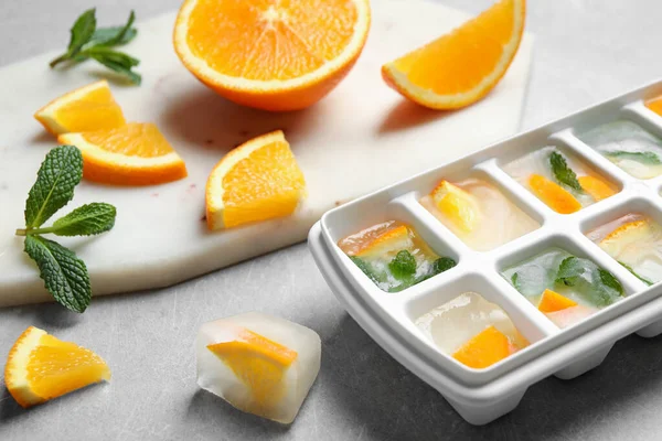 Ice Cubes Orange Mint Light Table Closeup — Stock Photo, Image