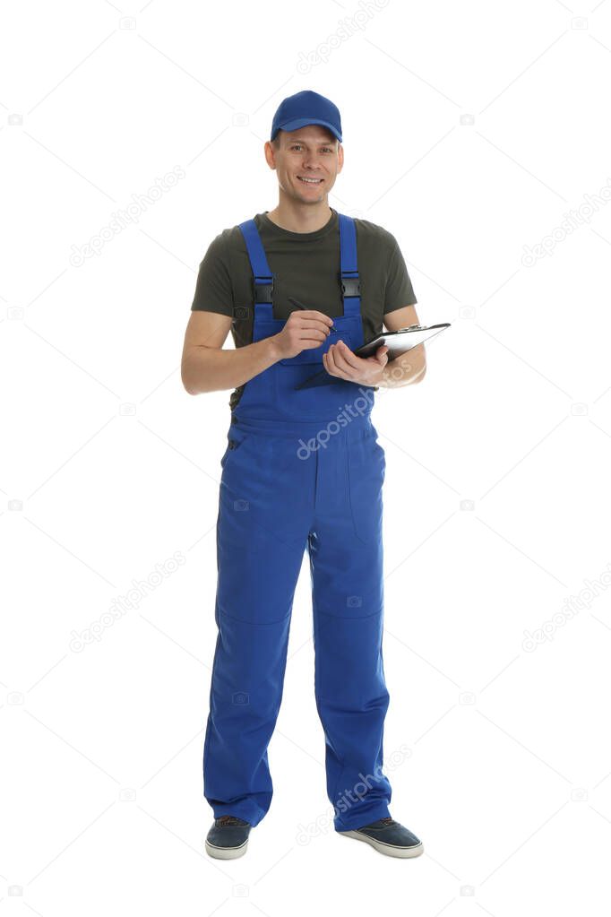 Full length portrait of professional auto mechanic with clipboard on white background