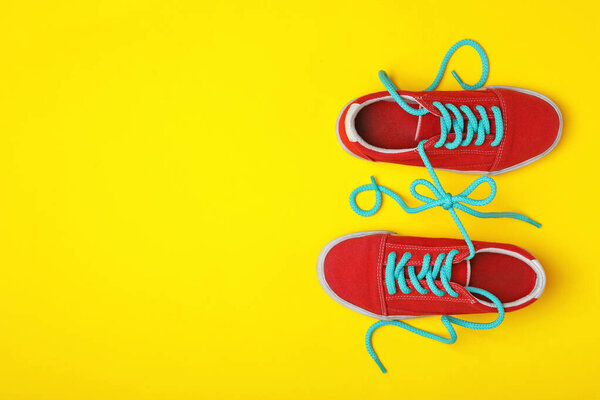 Shoes Tied Together Yellow Background Flat Lay Space Text April Royalty Free Stock Images