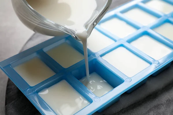 Pouring Milk Ice Cube Tray Table Closeup — Stock Photo, Image