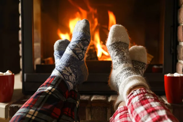 Couple Pajamas Resting Fireplace Indoors Closeup Winter Vacation — Stock Photo, Image