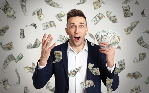 Happy Young Man Dollars Money Rain Light Background — Stock Photo, Image
