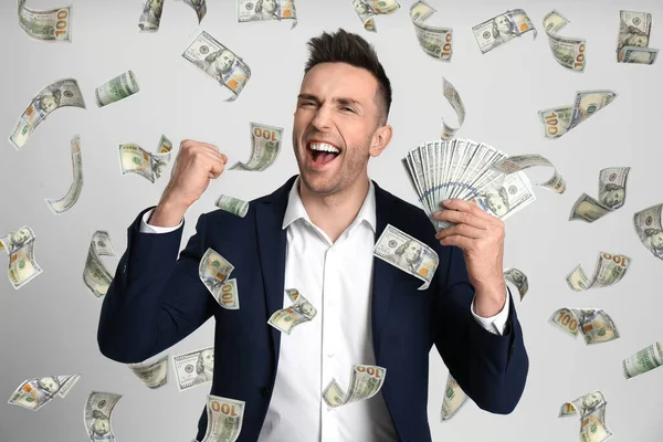Happy Young Man Dollars Money Rain Light Background — Stock Photo, Image