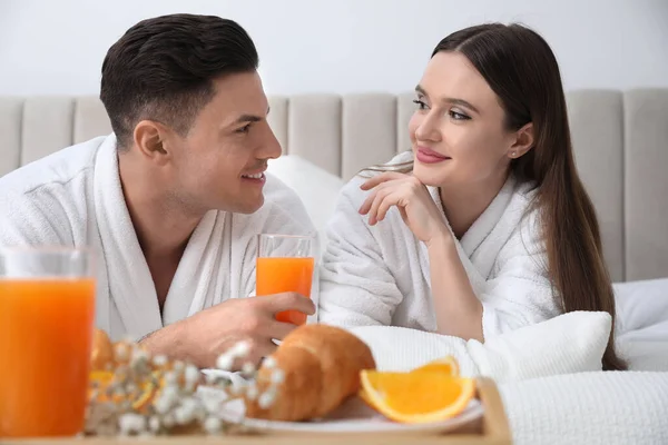 Happy Couple Bathrobes Having Breakfast Bed Home — Stock Photo, Image