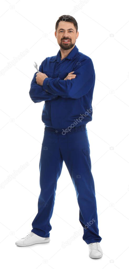 Full length portrait of professional auto mechanic with wrench on white background