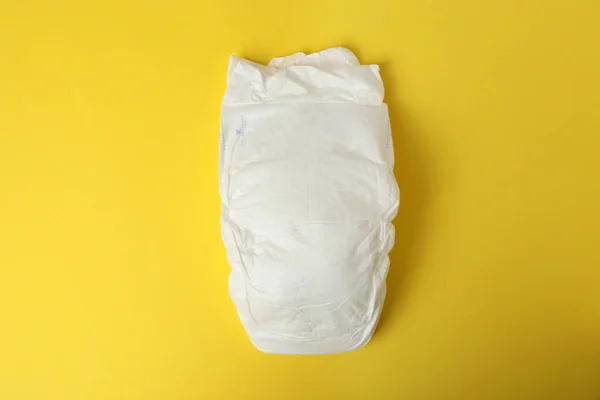 Baby Diaper Yellow Background Top View — Stock Photo, Image