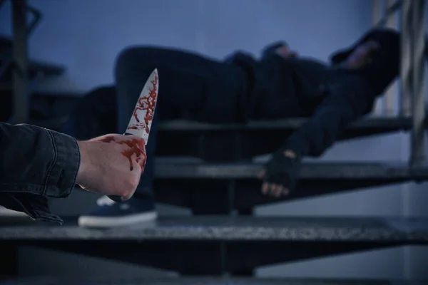 Man Bloody Knife Unconscious Person Stairs Indoors Space Text Dangerous — Φωτογραφία Αρχείου