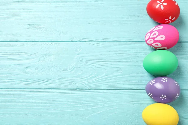 Colorful Easter Eggs Light Blue Wooden Background Flat Lay Space — Stock Photo, Image