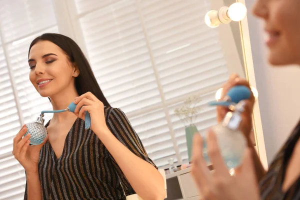 Young Woman Beautiful Makeup Applying Perfume Mirror Indoors — Stock Photo, Image