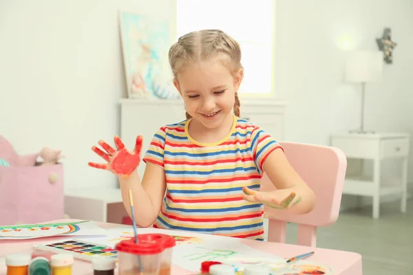 Cute Little Child Painting Palms Table — 스톡 사진