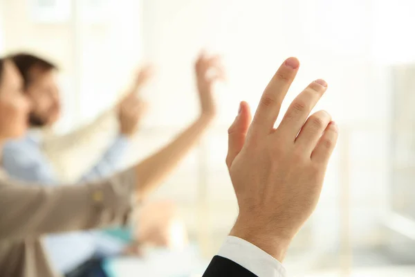 Young Man Raising Hand Ask Question Business Training Indoors Closeup — Stock Photo, Image