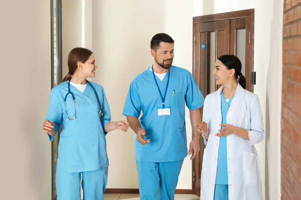 Group of doctors walking in clinic. Medical service