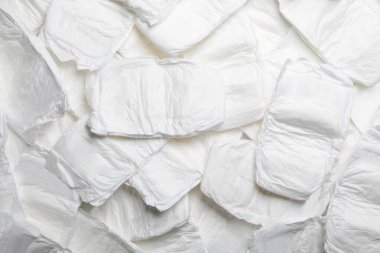 Arka plan olarak bebek bezi, üst manzara. Çocuk giysisi