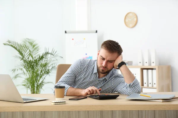 stock image Lazy young office employee procrastinating at workplace