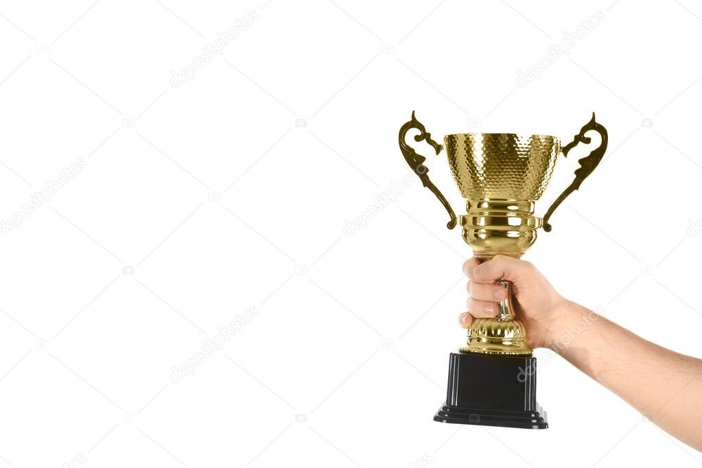 Man holding gold trophy cup on white background, closeup