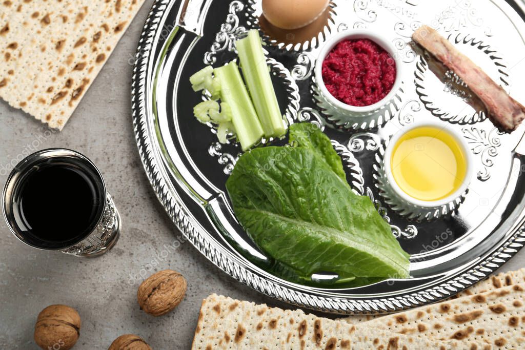 Flat lay composition with Passover Seder plate (keara) on grey table. Pesah celebration