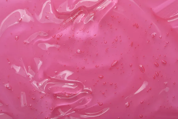 Чистый Прозрачный Косметический Гель Розовом Фоне Крупный План — стоковое фото