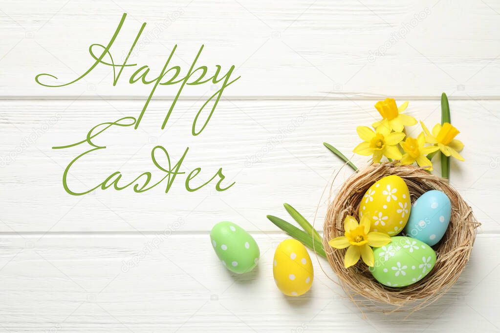 Flat lay composition with text Happy Easter and colorful eggs on white wooden background
