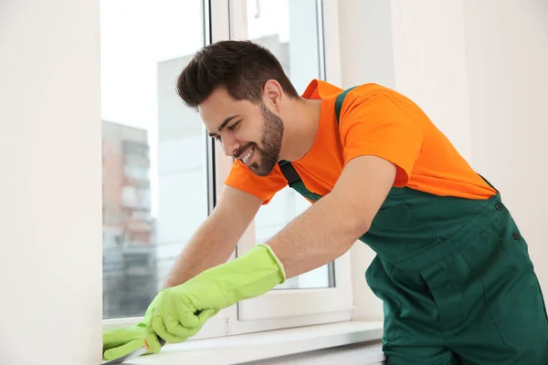 Professional Young Janitor Cleaning Windowsill Room — Stock Photo, Image