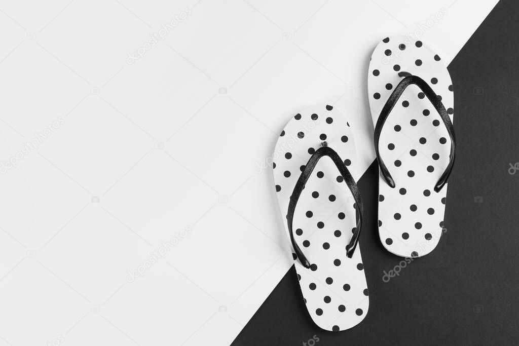 Stylish flip flops on color background, flat lay. Space for text