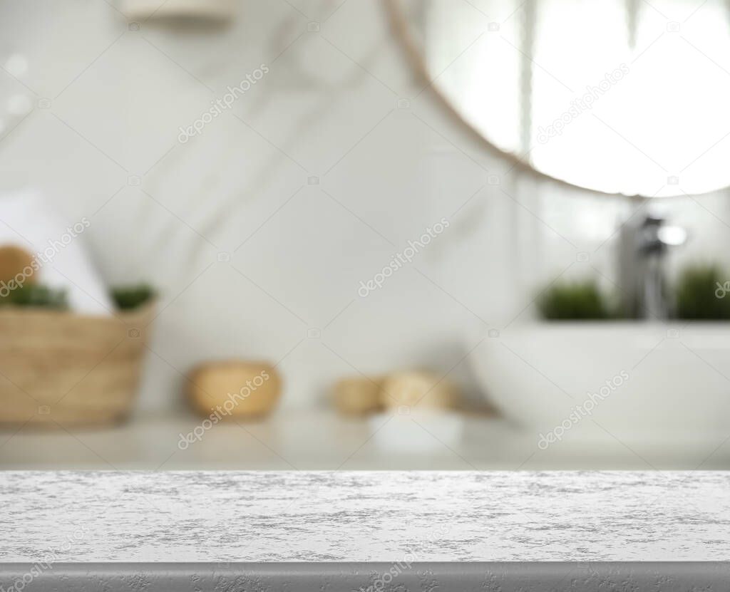 Empty table and blurred view of stylish bathroom interior