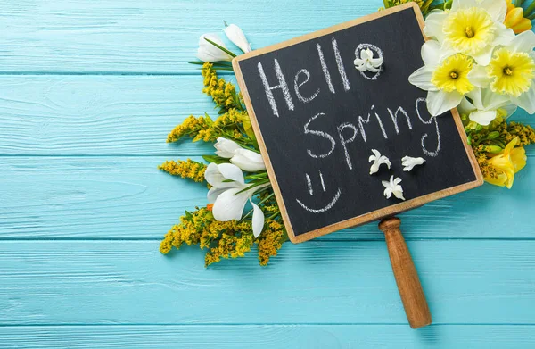 Blackboard Words Hello Spring Flowers Light Blue Wooden Table Flat — Stock Photo, Image