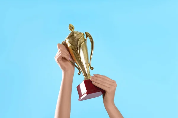 Woman Holding Gold Trophy Cup Light Blue Background Closeup — Stock Photo, Image