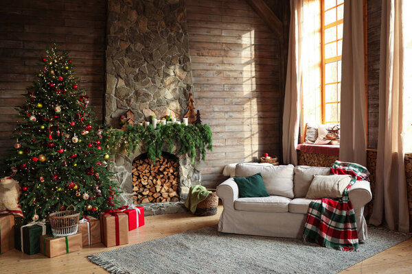 Festive interior with decorated Christmas tree and fireplace