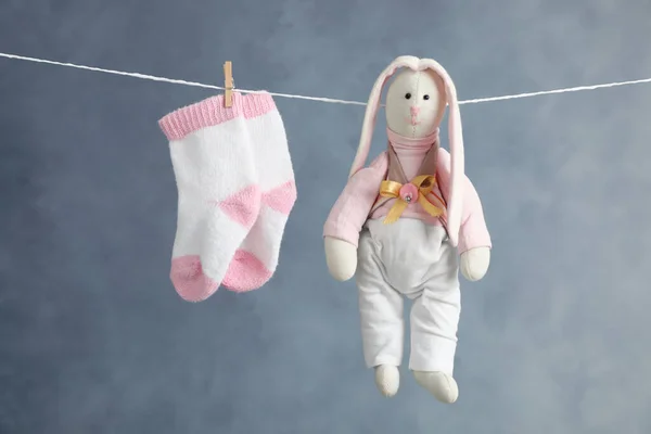 Pair Child Socks Toy Bunny Hanging Laundry Line Dark Background — Stock Photo, Image