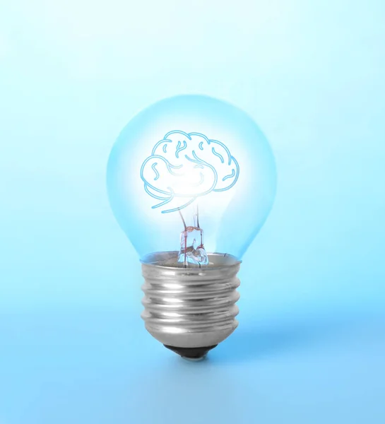 Lamp bulb with human brain inside on blue background. Idea generation