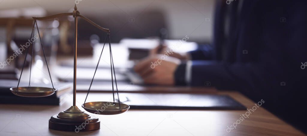 Scales of justice and blurred lawyer on background. Banner design