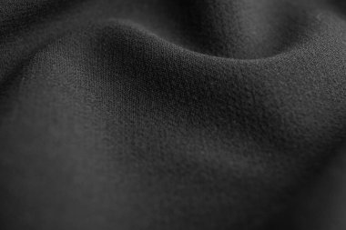 Arka plan olarak güzel koyu kumaş dokusu, yakın plan