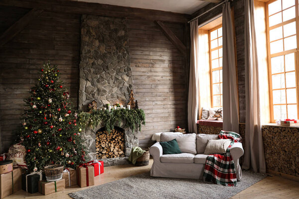 Festive interior with decorated Christmas tree and fireplace