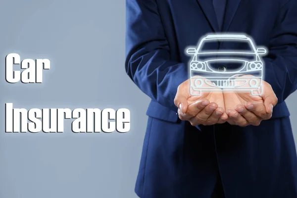 Man Demonstrating Image Auto Grey Background Closeup Car Insurance — Stock Photo, Image