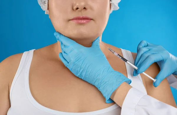 Woman Double Chin Getting Injection Blue Background Closeup Cosmetic Surgery — ストック写真